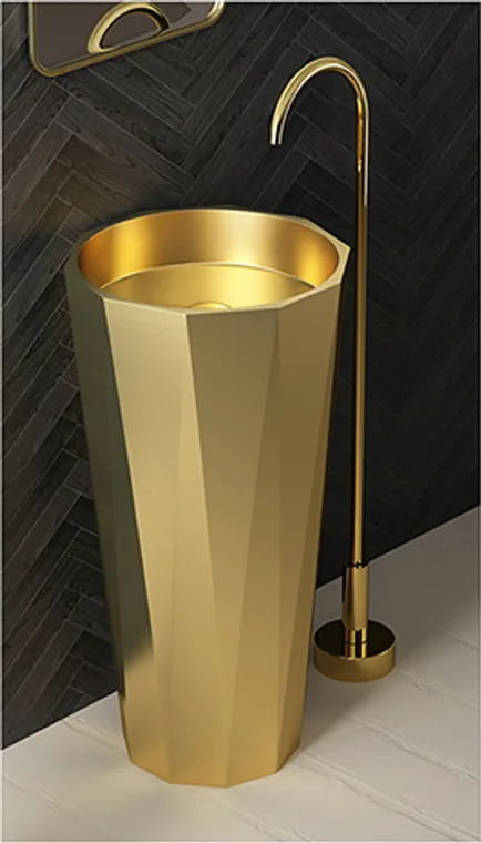 A diamond-shaped freestanding stainless steel pedestal basin with a gold finish and sculptural faceted body.